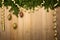 Christmas Wooden Background with fir tree, golden ribbon and dec