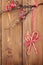 Christmas wooden background with holly berry branch and candy ca