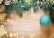 Christmas wooden background with pine and ball