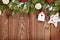 Christmas wooden background with snow fir tree and decor