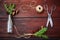 Christmas wooden background.Spruce branches and cones in a vintage bottle, the old scissors and crafty cord. The concept of traini