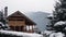 Christmas wooden mansion in mountains on snowfall winter day. Cozy chalet on ski resort near pine forest. Cottage of