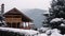 Christmas wooden mansion in mountains on snowfall winter day. Cozy chalet on ski resort near pine forest. Cottage of