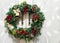 Christmas wreath with angel and bells on a rustic background.