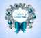 Christmas wreath with blue and white baubles.
