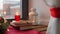 Christmas wreath, books, candle, lantern on window