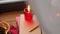 Christmas wreath, books, candle, lantern on window