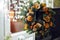 Christmas wreath of Christmas trees, tangerines, oranges and berries on a background of Christmas lights