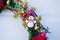 Christmas wreath decorated with fir-tree balls and toys, tinsel