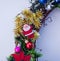 Christmas wreath decorated with fir-tree balls and toys, tinsel