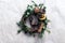 Christmas wreath with golden baubles and berries