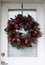 Christmas wreath hanging on front door