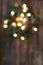 Christmas wreath with lights defocused background