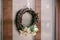 Christmas wreath made of dry twigs, leaves and needles.