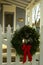 Christmas wreath on white picket fence