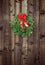 Christmas wreath on wooden fence