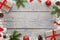 Christmas Xmas background with copy space for text. Christmas fir branches, giftse, lollipop, Santa hat, pinecones and snowflakes