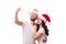 Christmas young beautiful couple in Santa hats in love taking romantic self portrait