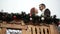 Christmas. Young Couple On The Wooden Balcony Decorated By A Holiday. Romantic Appointment. Town Hall.