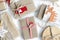 Christmas zero waste on white background. Hand crafted gifts with natural xmas decorationsw rapping craft paper without