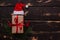 Christmass flatlay gift box,Santa hat and christmas spruce branch on wooden background.