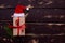 Christmass flatlay gift box,Santa hat and christmas spruce branch on wooden background.