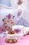 Christmass New Year decorations. Greeting card. White chocolate candy, gingerbread cookies, cup of coffee. Tender pink color.