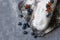 Christstollen, traditional winter Christmas dessert, fruit cake baked with raisins and decorated with blueberry, anise and sugar