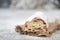 Christstollen, traditonal christmas cake with nuts, raisons, marzipan on a blue background, empty space for text