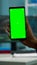 Chroma key isolated display on smartphone used by scientist woman
