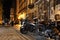 Chrome elements of stylish motorcycles in the lights of the ancient evening city of Lviv in Ukraine. Tourist trip of bikers.