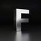 Chrome letter F uppercase. 3D render shiny metal font isolated on black background