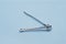 chrome nail scissors tweezers clipper blue background