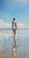 Chrome Reflections: Jonathan Walking Alone On Beach - Uhd Pictorial Dreams
