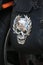 Chrome skull in a Laurel wreath on a motorcycle case, close-up