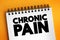 Chronic pain - classified as pain that lasts longer than three to six months, text concept on notepad