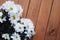 Chrysanthemum camomile White Flower Bouquet over rustic Wooden Background with Copy space.