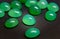 Chrysoprase gemstones.Opaque green gemstone.Dark colored stones are rare.Focus on the center.The background is blurred