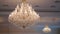 Chrystal chandelier close-up. Detail of luxurious restaurant interior