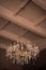 Chrystal chandelier lamp on the ceiling in Dining room Adjusting the image in a Luxury tone .Decorative elegant vintage and