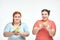 Chubby women: one woman is holding a sandwich,another one holding an apple