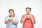 Chubby women: one woman is holding a sandwich,another one holding an apple