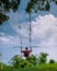 Chumphon Thailand, Khao Matsee Viewpoint view over ocean of Chumphon, men in swing above ocean