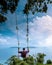 Chumphon Thailand, Khao Matsee Viewpoint view over ocean of Chumphon, men in swing above ocean