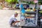 Chumphon, Thailand-October 14, 2019 : Grandfather Hands are filling the air in the tires of the motorcycle wheels  close-up