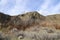 A chunk of mountain, with blue sky, at Knox mountain park in Canada