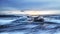 Chunks of ice on Diamond Beach. Ice is deposited on the beach from the nearby Jokulsarlon glacier lagoon. Sunrise in Iceland.