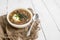 Chunky Italian wedding soup on a light wood background table