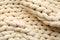 Chunky knit blankets as background, top view