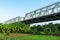 Chuong Duong bridge crossing above green cultivated farmland in Hanoi, Vietnam